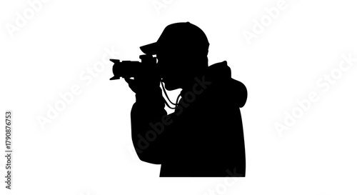 Silhouette of a photographer capturing a moment with their camera