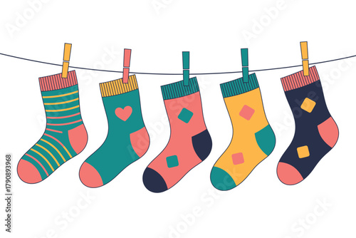 Colorful patterned socks are hanging on a clothesline, drying in the sun.