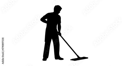 A silhouette of a person cleaning a floor with a mop