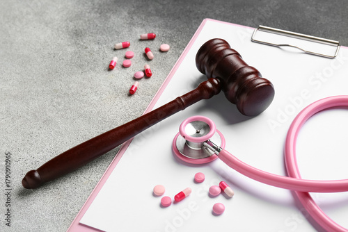 Judge gavel, clipboard, pil...