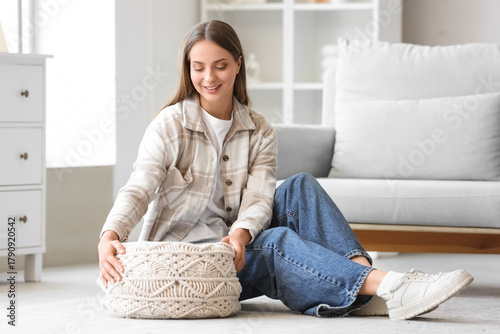 Young woman with knitted po...