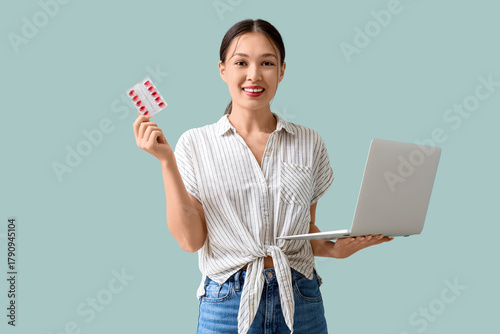 Young Asian woman with vita...