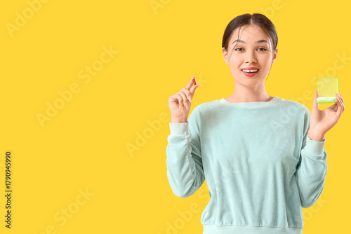 Young Asian woman with vita...