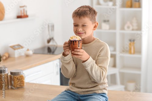 Cute little boy with cup of...