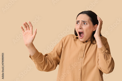 Screaming young woman on be...