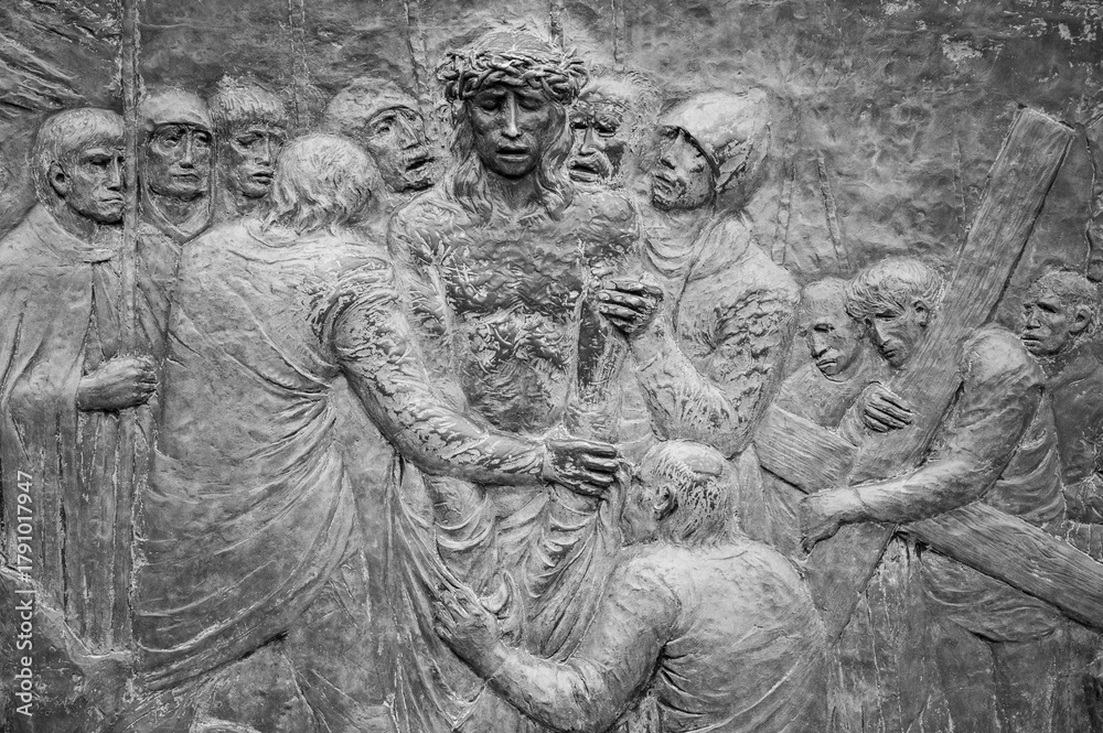 Fototapeta premium Station X: Jesus is stripped of his garments (Division of robes). The Way of the Cross on Mount Križevac (the Cross Mountain) in Medjugorje.