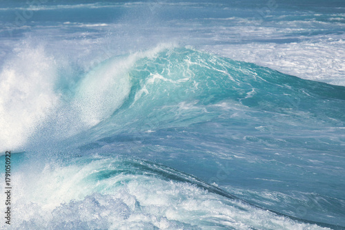 Aqua blue crashing surf on the Maui coast.