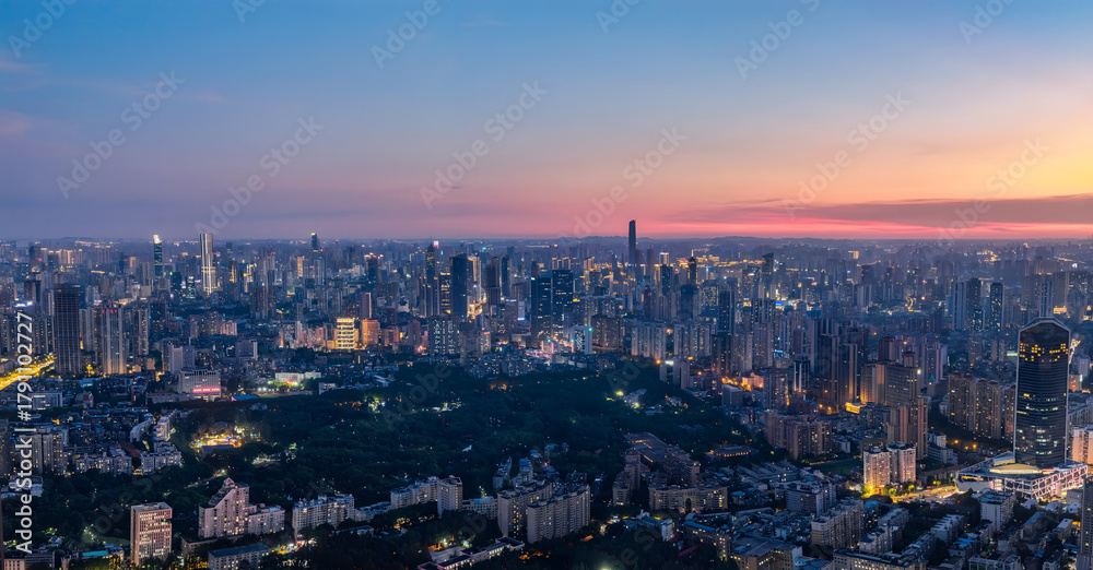 Fototapeta premium Wuhan Skyline at Sunset - Aerial View with Illuminated Urban Cityscape