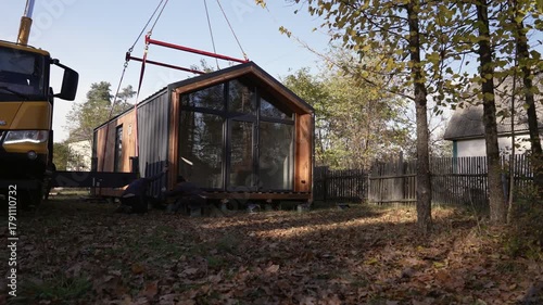 Precise installation of a modular house on piles.