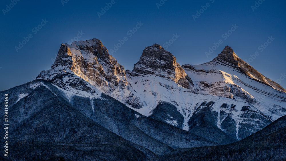 Fototapeta premium Snow covered mountains at sunset