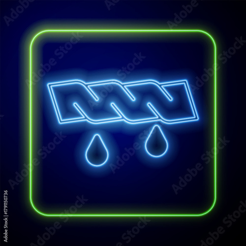 Glowing neon Squeeze clothes icon isolated on blue background. Vector