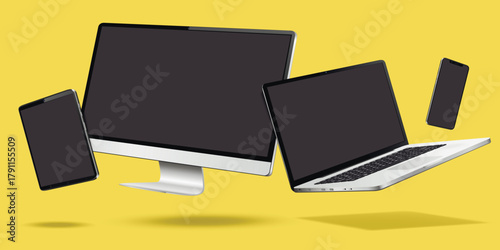 Computer, laptop, smartphone and tablet while levitating in the air on a yellow background