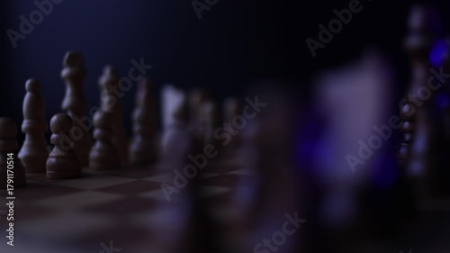 Wallpaper Mural Rotating chessboard with strategically placed pieces in motion, depicting the eternal struggle between black and white factions in cerebral gameplay. Semi-darkness and blue backlight Torontodigital.ca