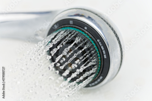 Modern Rain Shower Head Releasing High-Pressure Water Streams