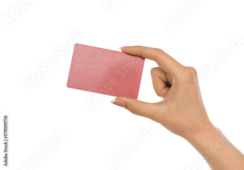 Fototapeta Naklejka Na Ścianę i Meble -  Female hand holding a blank card, showcasing it as a symbol of payment, promotion, or banking service. Isolated on white background.
