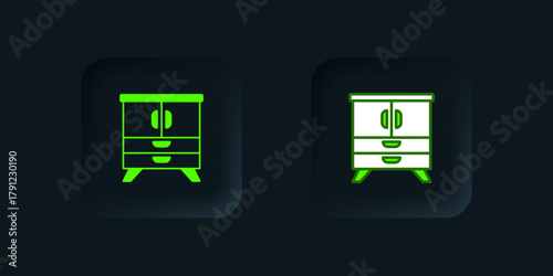 Green Chest of drawers icon isolated on black background. Black square button. Vector