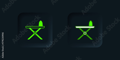 Green Electric iron and ironing board icon isolated on black background. Steam iron. Black square button. Vector