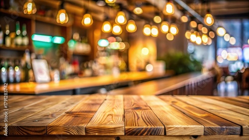 Wood table top bar with blur colorful light bokeh in cafe