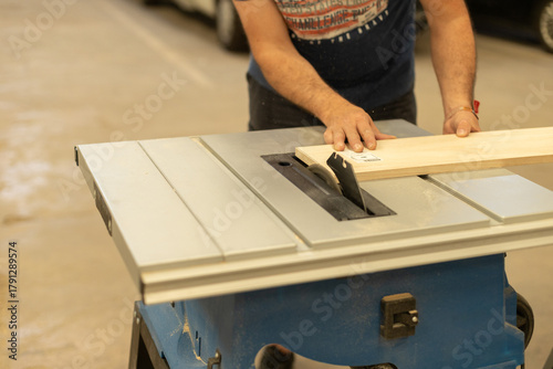 Young man renovating a caravan to convert it into a camper van