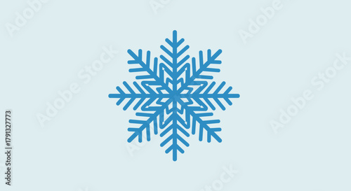 Illustrative blue snowflake design against a pale blue background conveying winter