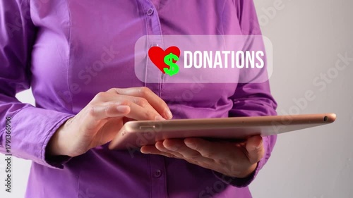 Close-up of a businesswoman interacting with her tablet featuring an animated donation button
