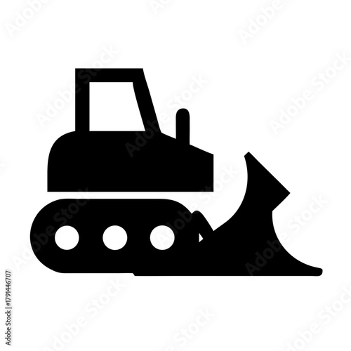 Bulldozer with metal blade constructing earth and dirt in site