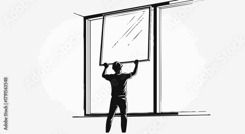 A worker carefully lifts and positions a large glass window pane into a modern architectural frame, illustrating construction and installation work.