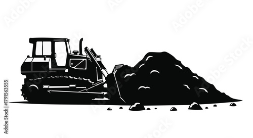 A powerful bulldozer in a stark black silhouette actively pushes a large pile of earth, representing essential heavy construction and excavation work.