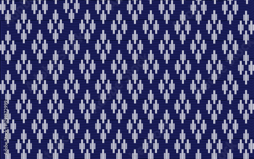 Traditional Lao or Southeast Asian indigo blue and white woven textile pattern. Features repeating geometric diamond and vertical dash motifs with a textured, handcrafted feel.