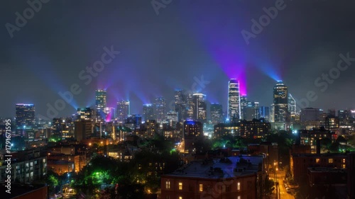 Wallpaper Mural Night cityscape with illuminated skyscrapers and colorful light beams emanating from above Torontodigital.ca
