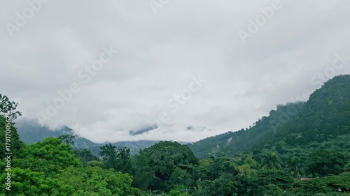 Wallpaper Mural Timelapse video of mountains with moving clouds and birds flying in the air surrounded by nature Torontodigital.ca