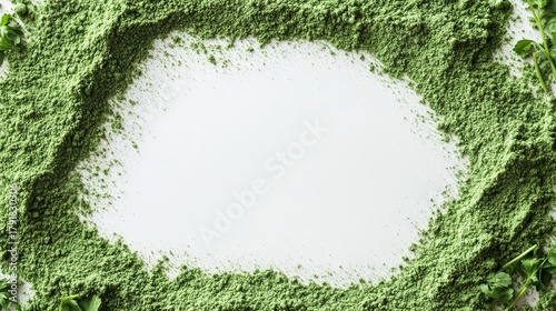 Minimalist composition featuring geometric frame precisely formed from finely milled wheat grass powder, rich emerald green color against stark white surface, subtle variations in powder density