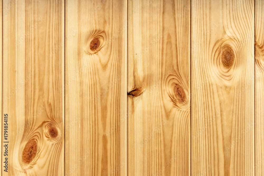 Obraz premium Close-up of wooden wall or floor made from plain planks showing nice natural wood grain and big knots