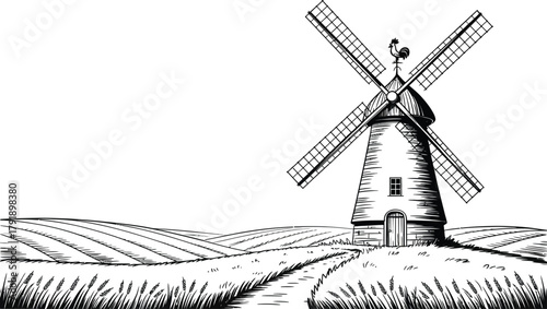 A vintage windmill stands on a rolling field under a bright sky.