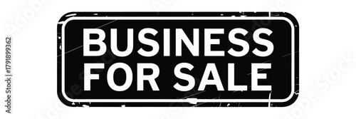 Black and white sign indicating business for sale