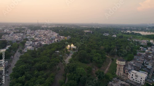 Wallpaper Mural Aerial view of the picturesque city of Banswara near Udaipur, Rajasthan, India, captured during a breathtaking sunrise, showcasing a cinematic blend of urban charm and natural beauty.	 Torontodigital.ca