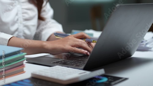 Wallpaper Mural Businesswoman analyzing financial data on laptop Torontodigital.ca