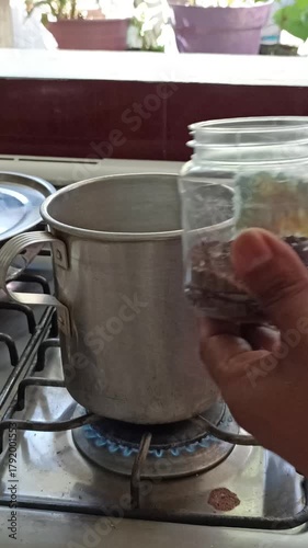 opening a jar of honey to sweeten coffee