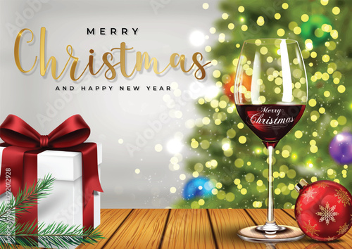Elegant Christmas Celebration With Gift Box, Wine Glass, And Golden Script On Warm Wooden Table