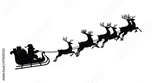 Silhouette of santa claus in his sleigh pulled by a team of reindeer flying across the sky