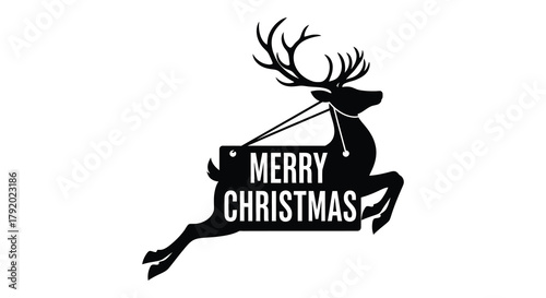 Silhouette of a leaping reindeer with a merry christmas sign hanging from its antlers