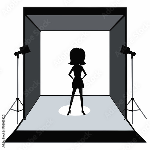 Silhouette of a woman posing in a photography studio with lights