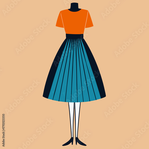 Stylized dress on mannequin with pleated skirt and orange top
