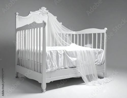 Elegant white crib with draped sheer canopy
