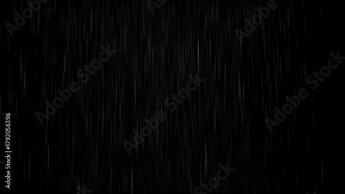 Realistic falling rain on black background, heavy rainfall storm effect, natural weather element overlay for visual effects and compositing