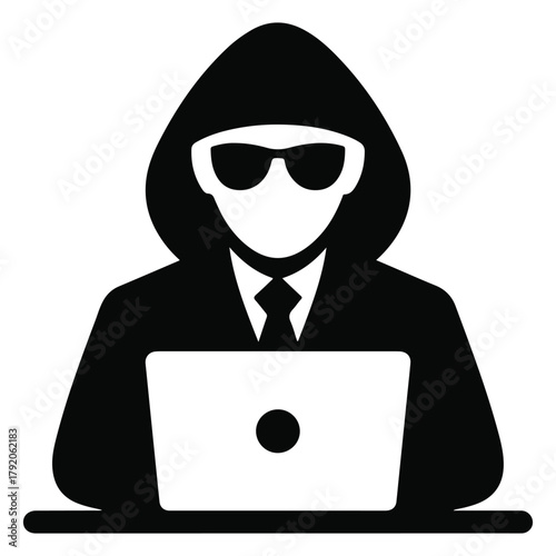 Hacker wearing sunglasses and hoodie using laptop computer