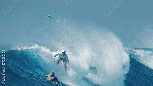 Surfer rides the wave on the famous Sultans surf spot located on the Northern Atolls in the Maldives