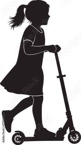 Young girl riding a scooter in silhouette