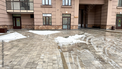 Pale urban snowscape whispers echoes of solitary winter solstice, minimalist architecture, icy tranquility in unexpected seclusion