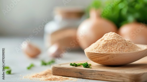 A rustic wooden spoon overflowing with fragrant onion powder.